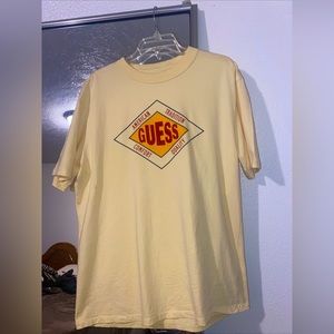 Vintage Guess Originals Logo 80s-90s T Shirt Color: Peach/Yellow SIZE: Medium